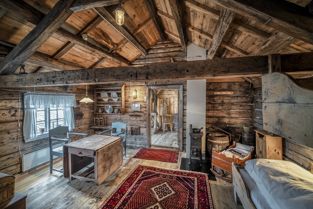 Historic hotel room with timber walls at Håholmen